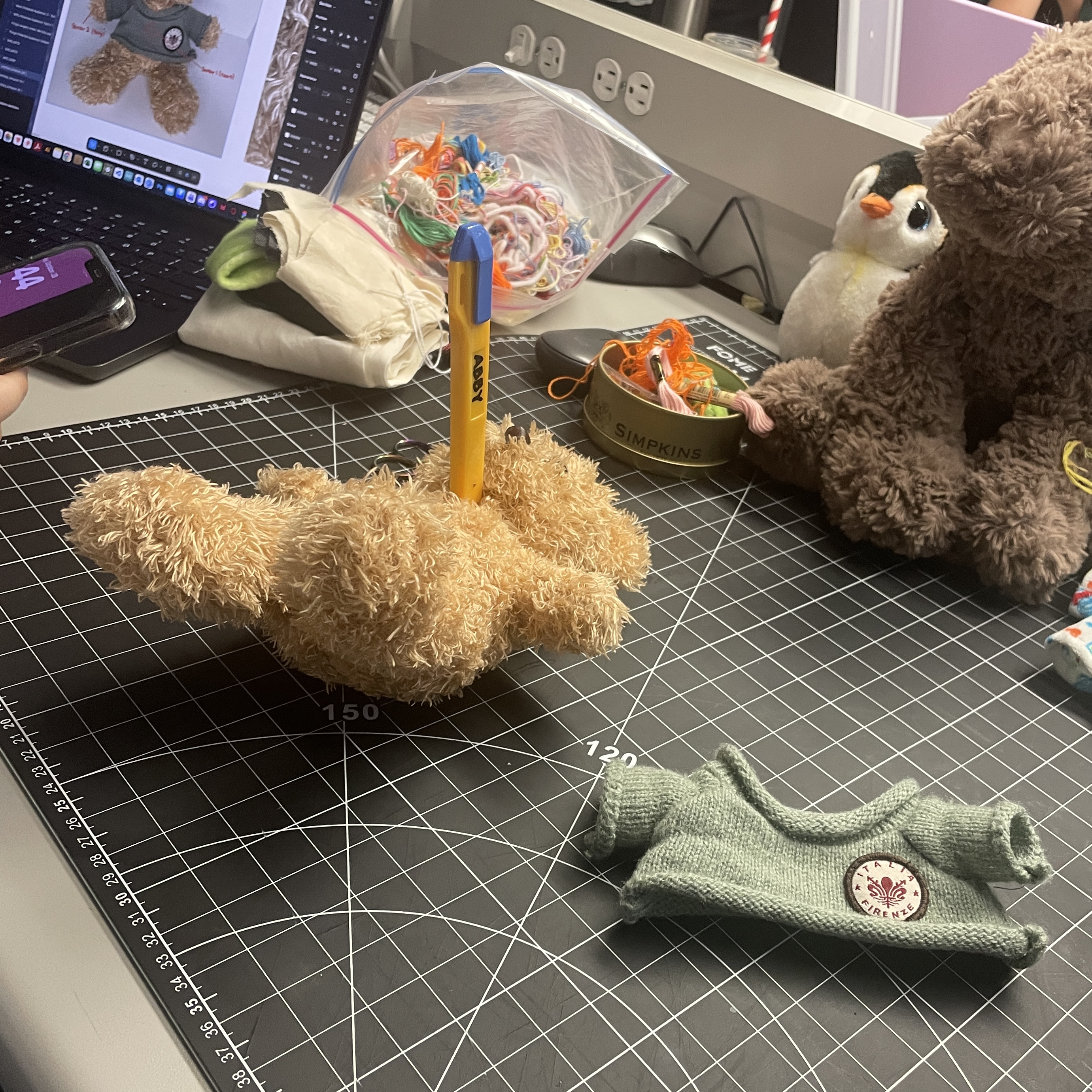 My partner Lucy and I cut open the plushies to analyze their fabric. This image shows us working with Mario the bear.